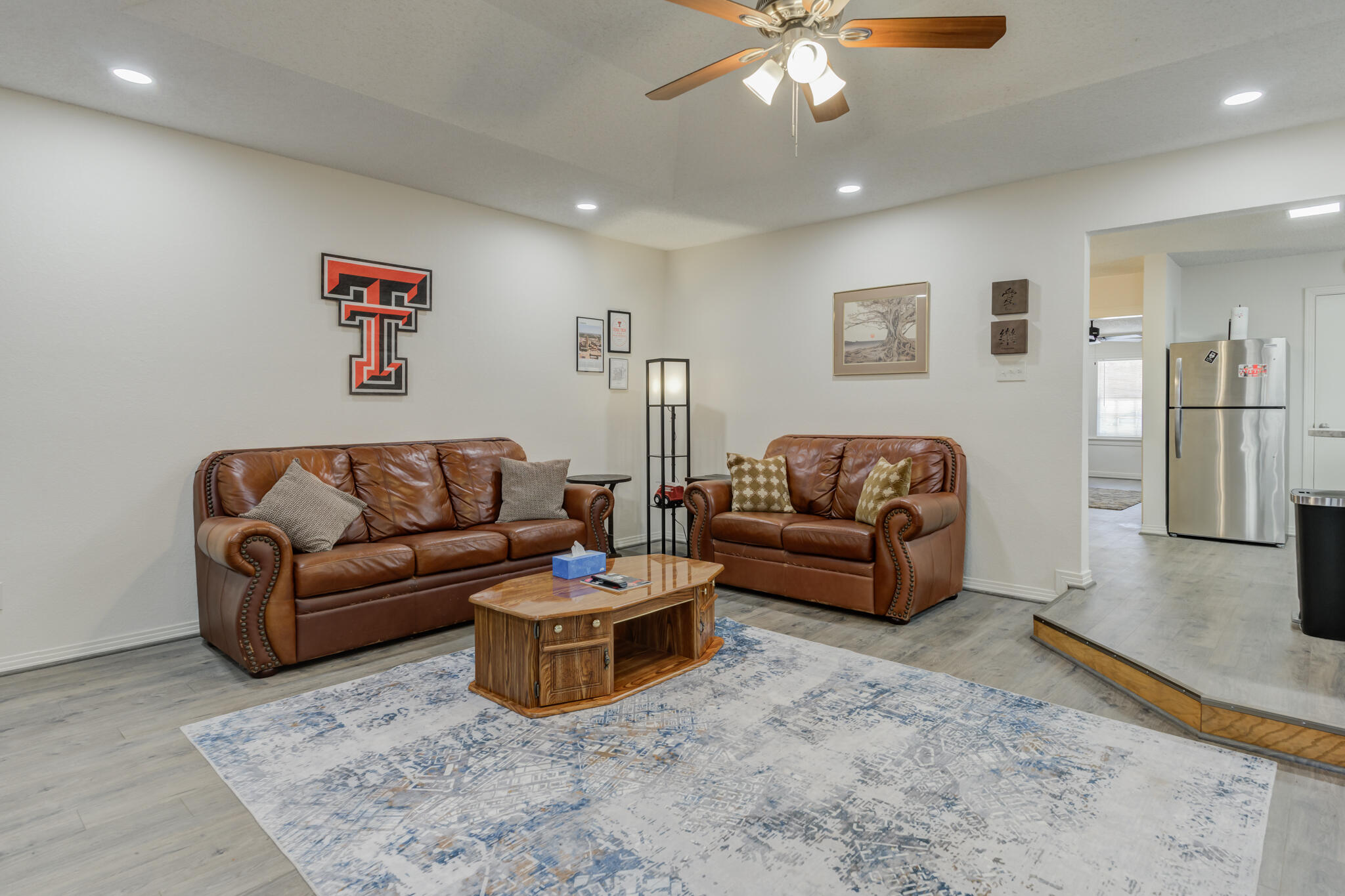 2822 23rd Street Lubbock, TX 79410 - Photo 19 of 39 a living room with furniture and a flat screen tv