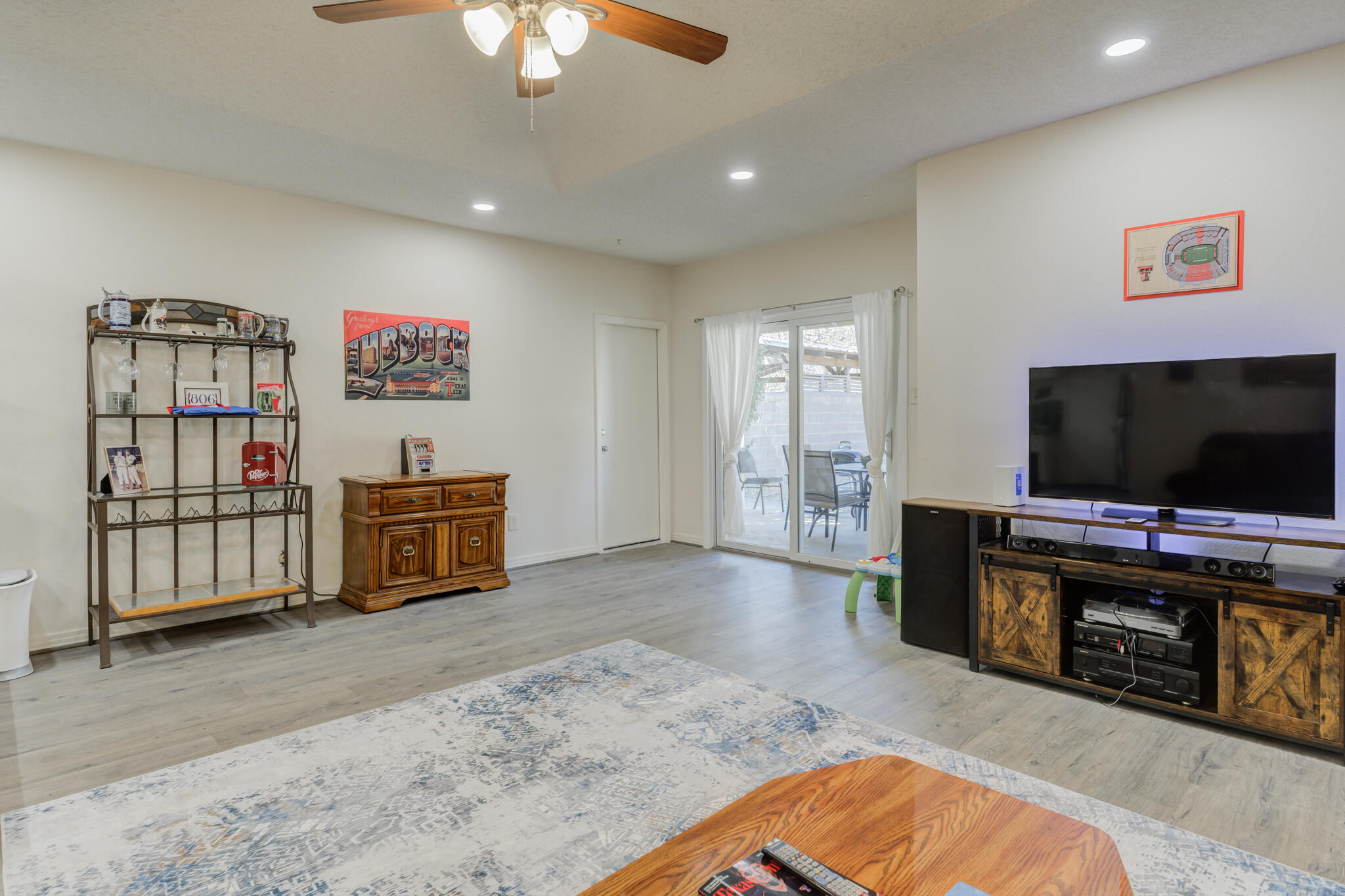 2822 23rd Street Lubbock, TX 79410 - Photo 22 of 39 a view of a livingroom with furniture and a flat screen tv