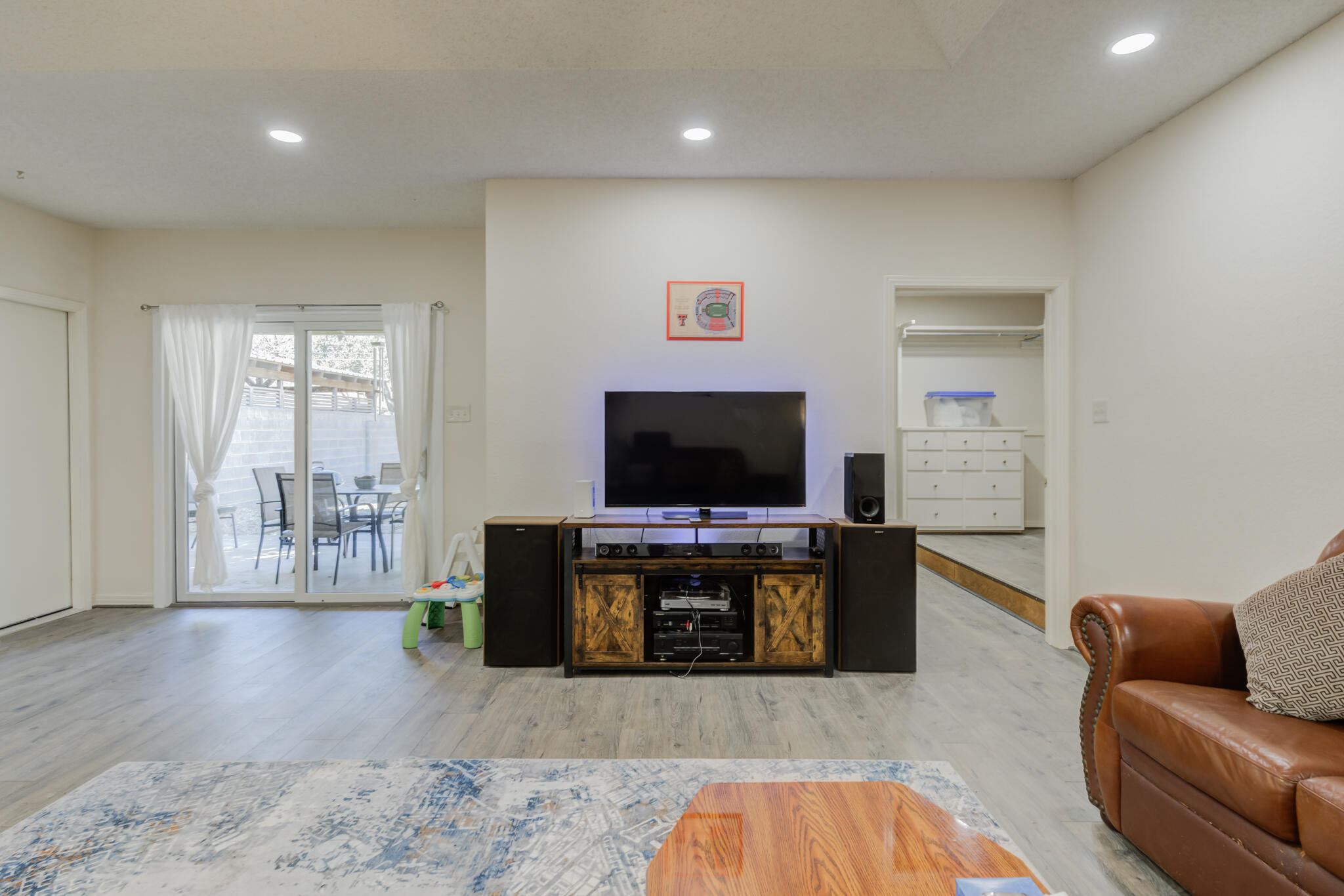 2822 23rd Street Lubbock, TX 79410 - Photo 23 of 39 a living room with furniture and a flat screen tv
