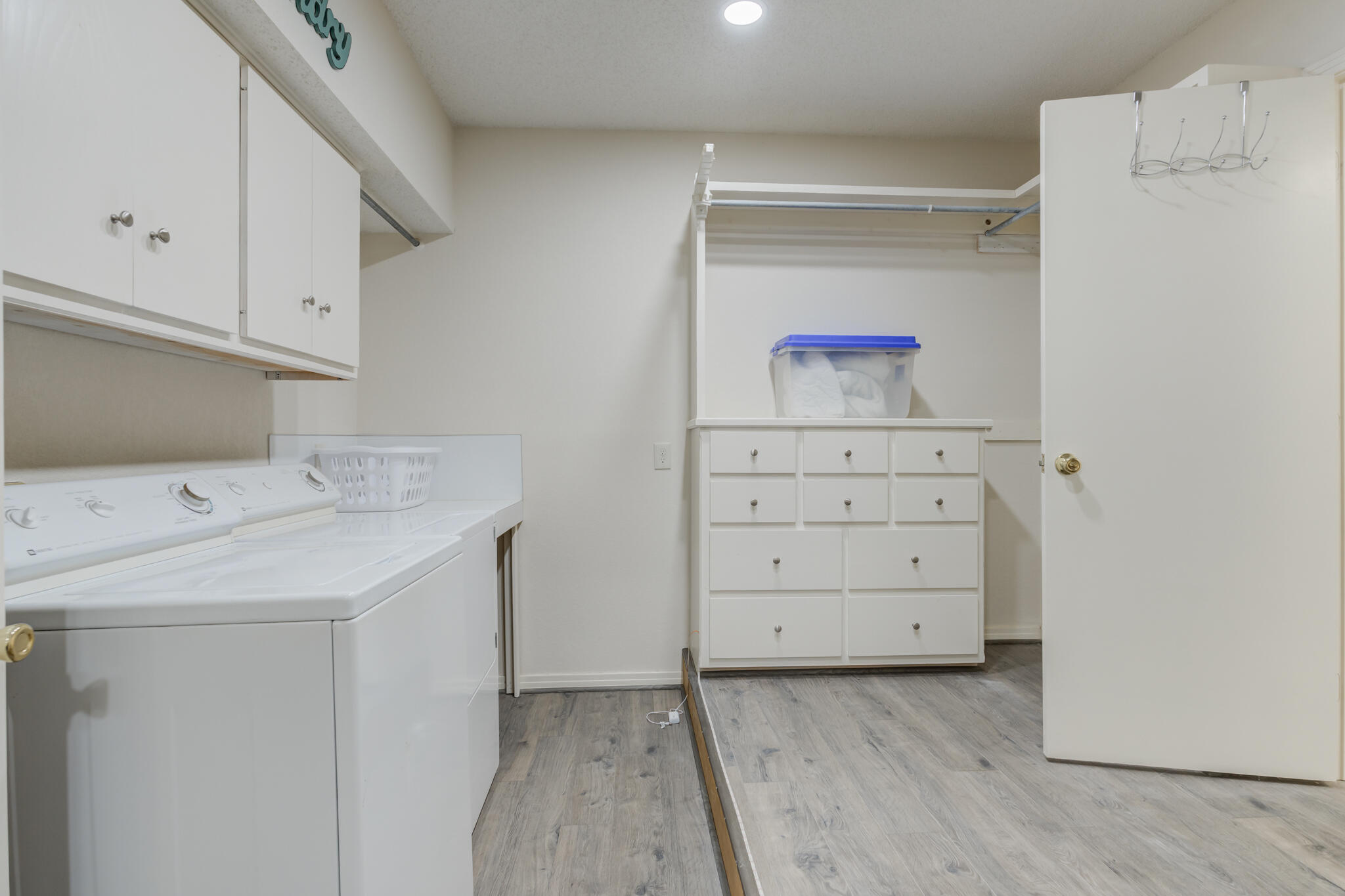 2822 23rd Street Lubbock, TX 79410 - Photo 24 of 39 a utility room with cabinets washer and dryer