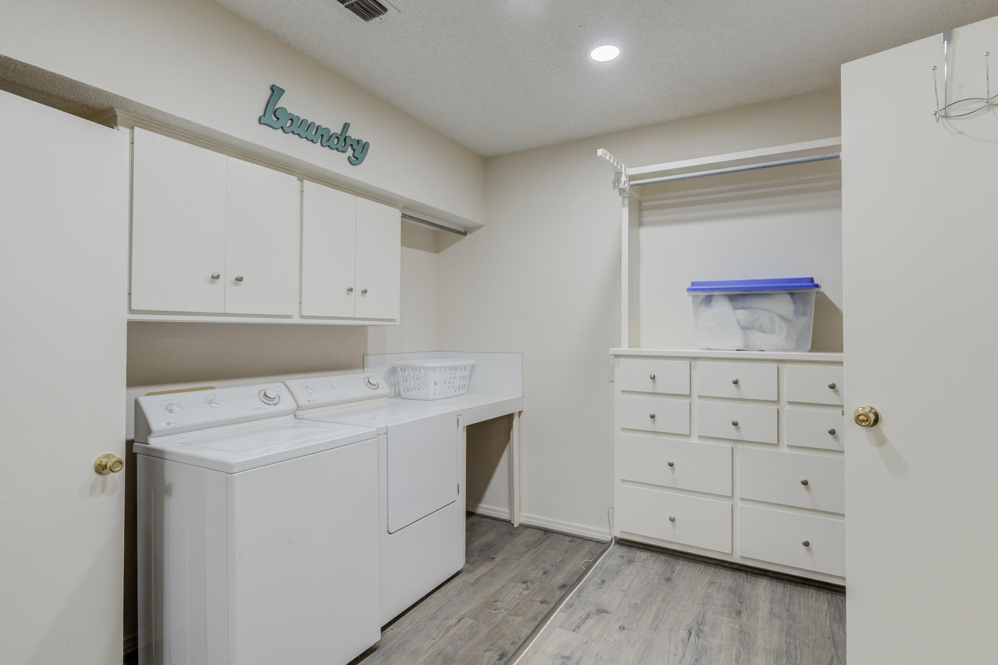 2822 23rd Street Lubbock, TX 79410 - Photo 25 of 39 a utility room with cabinets washer and dryer