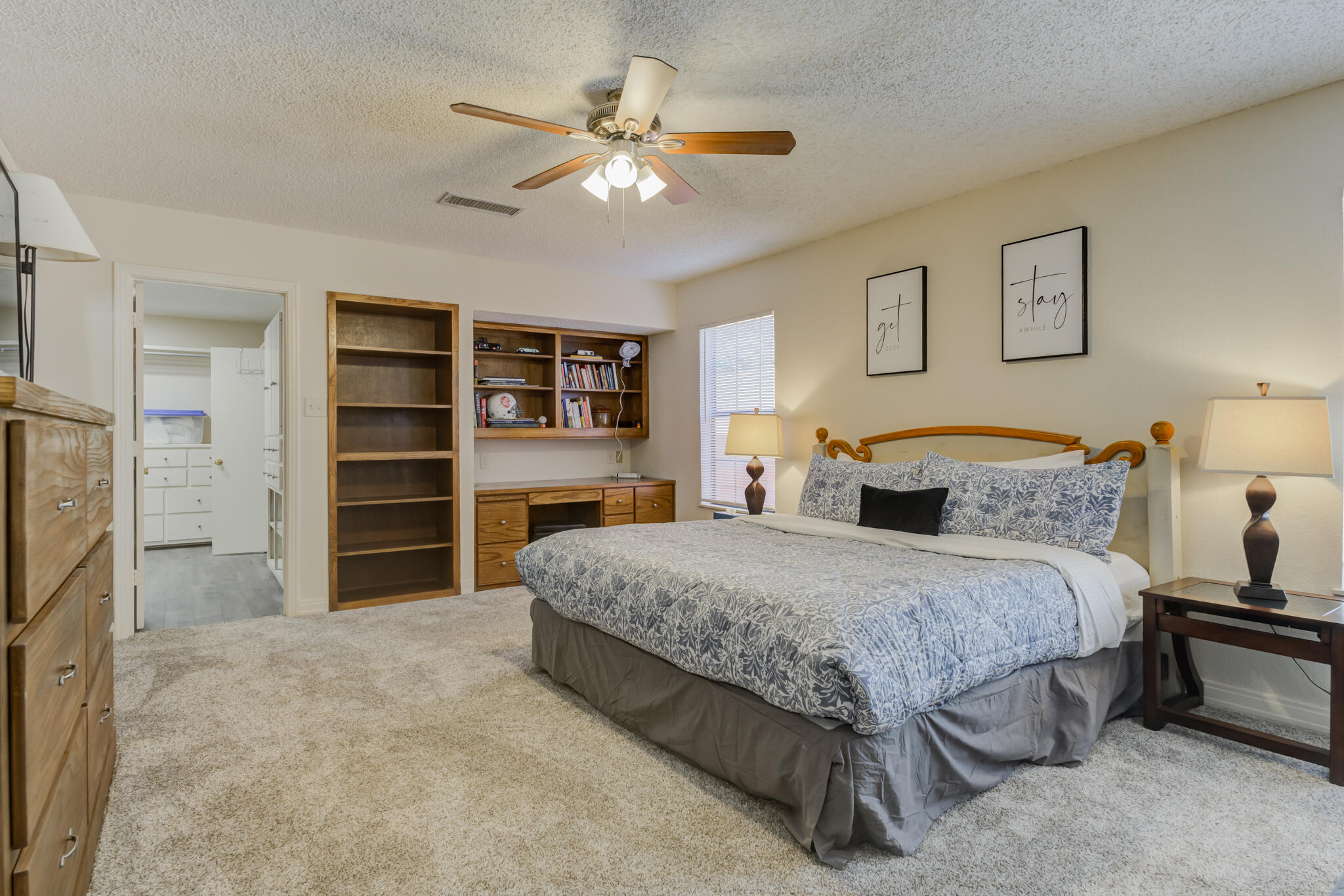 2822 23rd Street Lubbock, TX 79410 - Photo 30 of 39 a spacious bedroom with a bed and a television