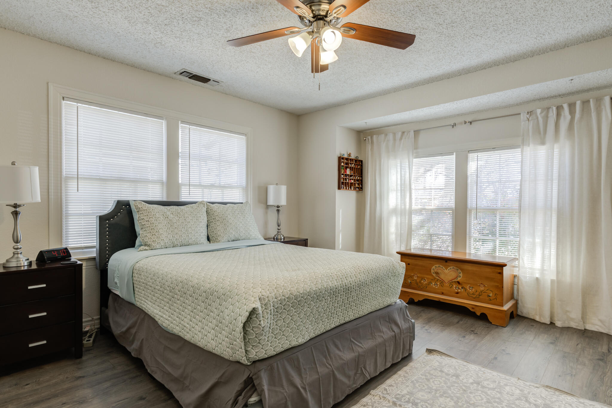 2822 23rd Street Lubbock, TX 79410 - Photo 34 of 39 a bedroom with a bed and a chandelier