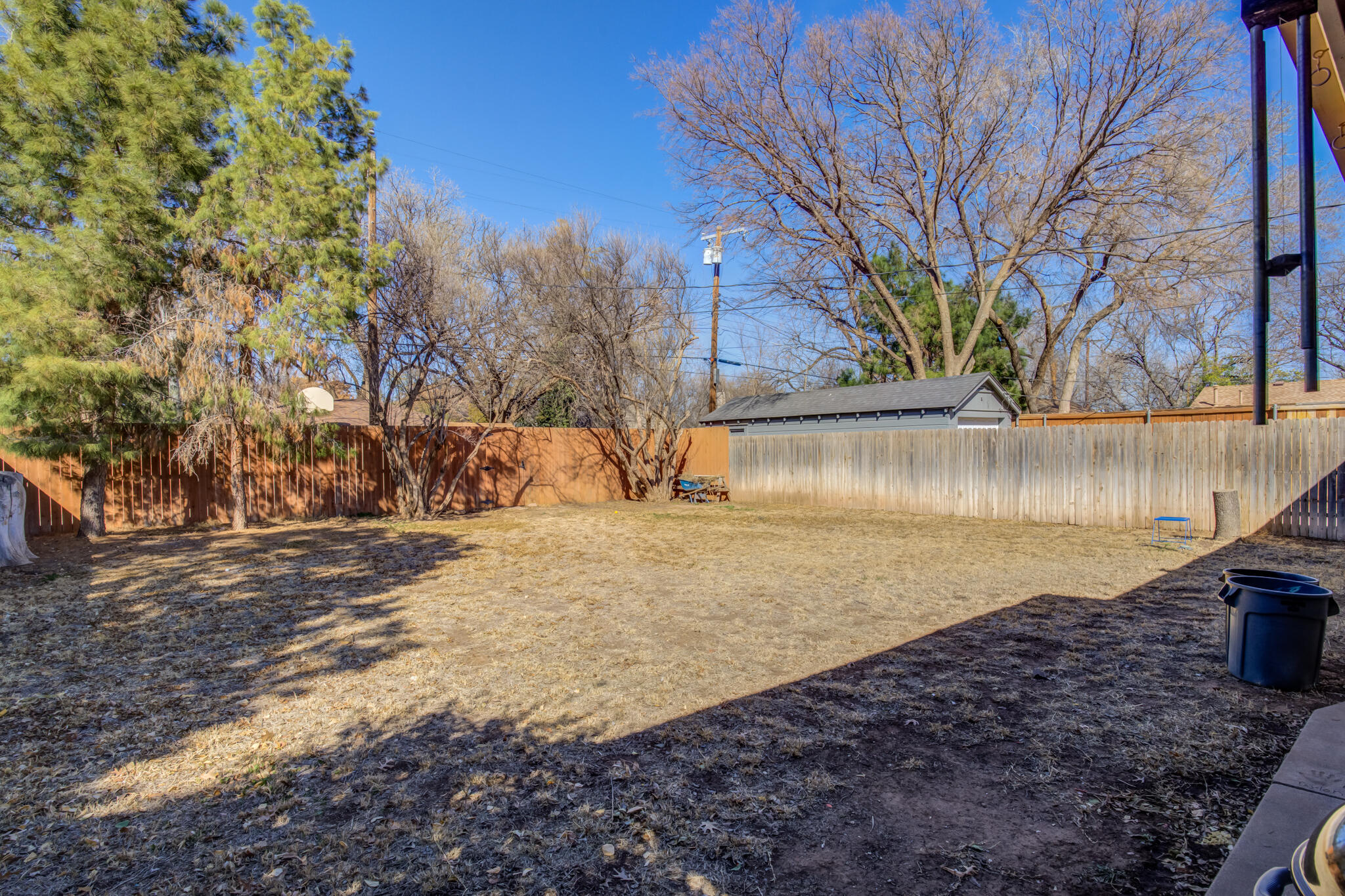 2822 23rd Street Lubbock, TX 79410 - Photo 37 of 39 a view of a yard with wooden fence