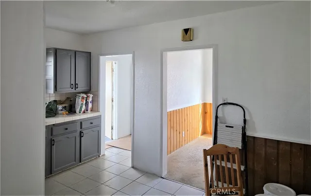 a kitchen with a refrigerator and sink