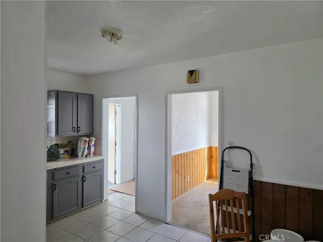 a bathroom with a sink and cabinets