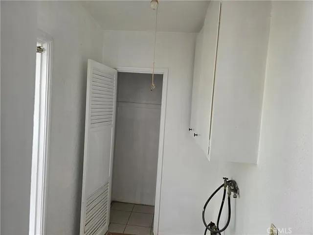 an empty room with a windows