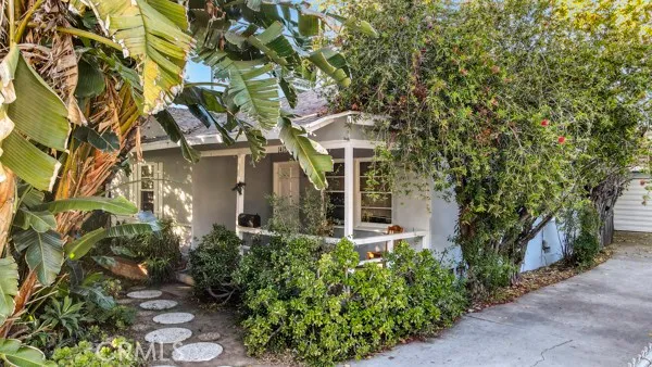 a view of a house with a tree