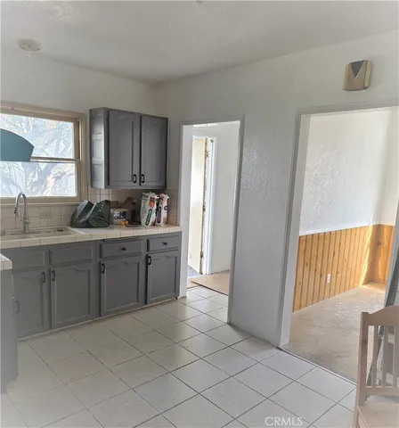a kitchen with a sink and cabinets