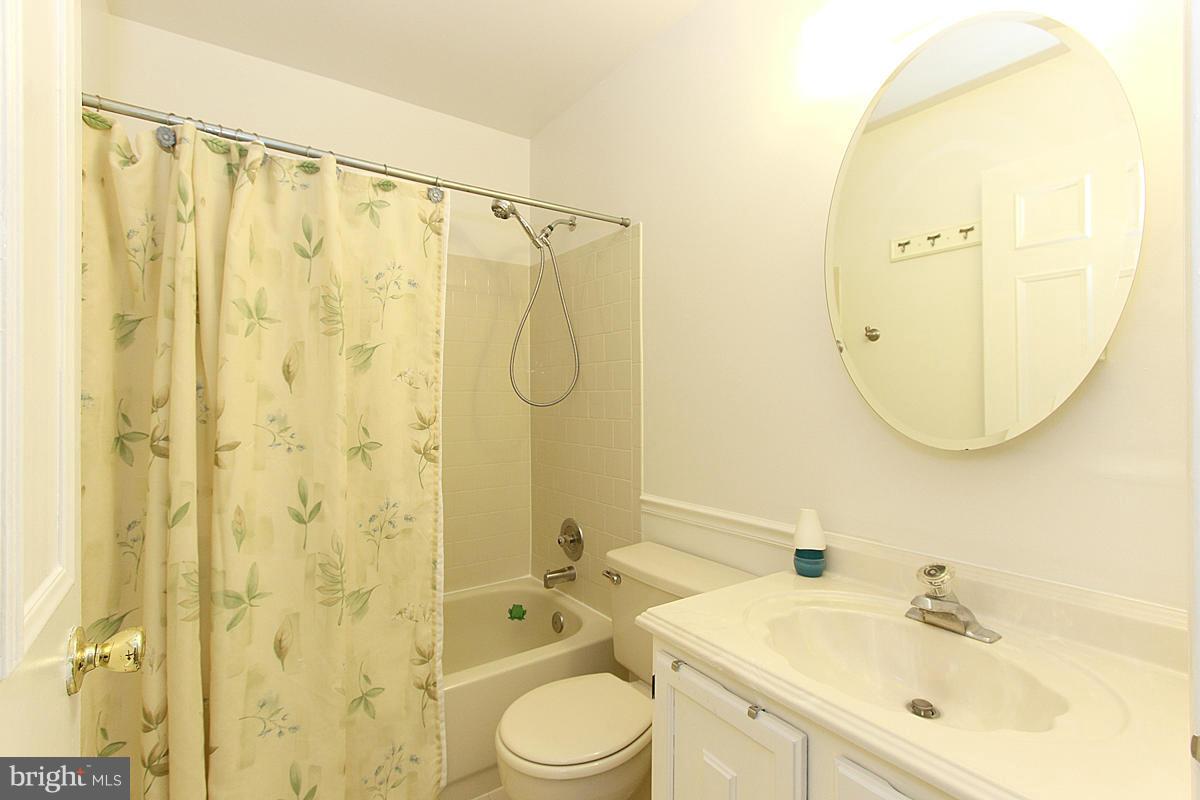 6250 Rathlin Drive Springfield, VA 22152 - Photo 14 of 20 a bathroom with a sink a toilet and shower