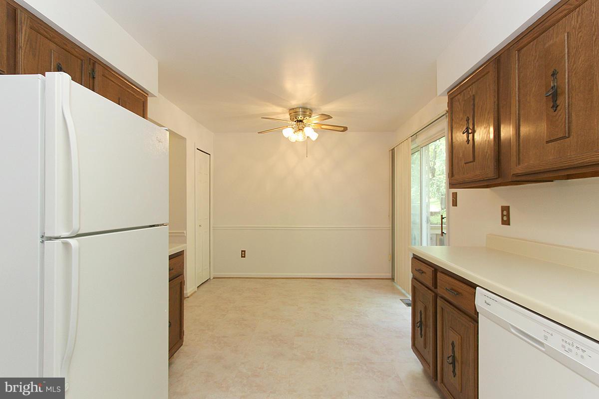 6250 Rathlin Drive Springfield, VA 22152 - Photo 8 of 20 a view of a kitchen with a sink and a refrigerator