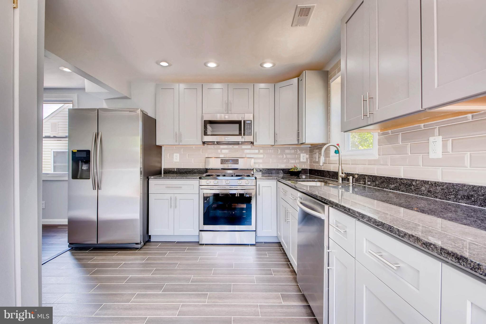 10 Village Road Pikesville, MD 21208 - Photo 5 of 28 Open Concept kitchen overlooking back yard