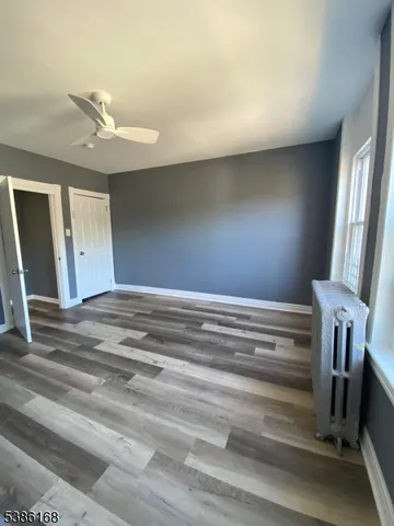 a view of room with a ceiling fan