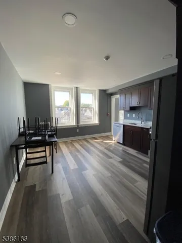 a room with furniture and a wooden floor