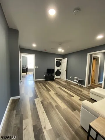 a bedroom with a bed and a large mirror