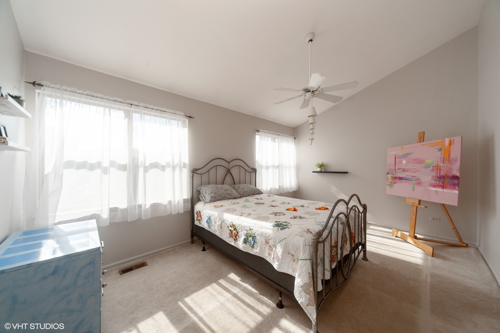 970 Ridgefield Lane, Unit 970 Wheeling, IL 60090 - Photo 7 of 10 a bedroom with a bed and a large window