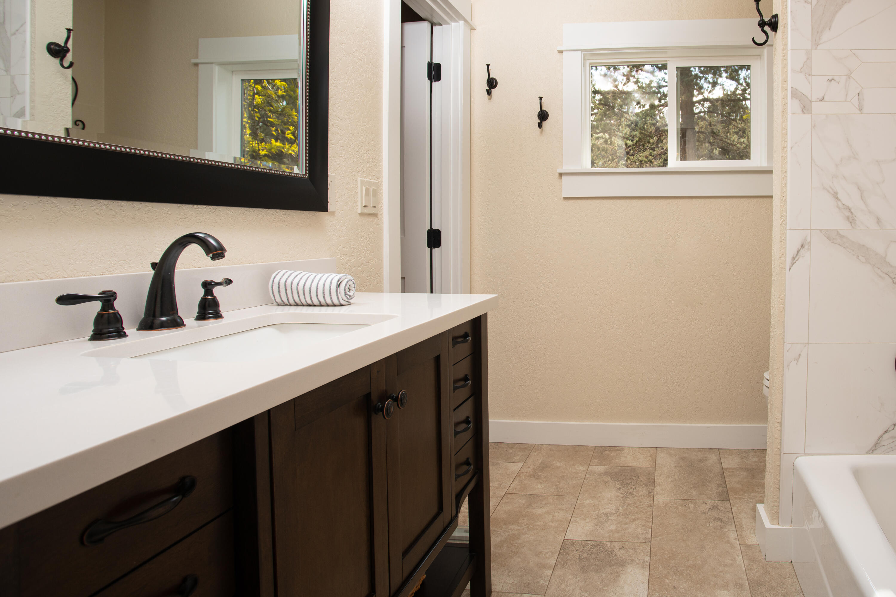 61405 Ward Road Bend, OR 97702 - Photo 34 of 37 a bathroom with a sink and a mirror