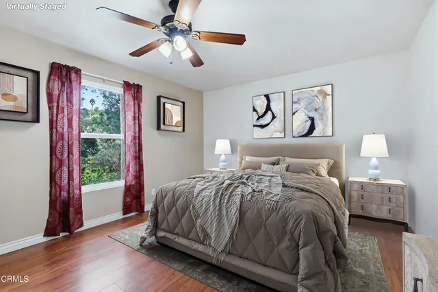 a bedroom with a large bed and a window