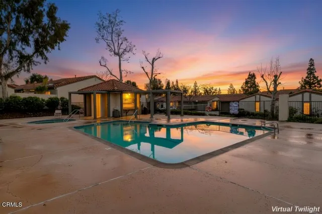 a view of a swimming pool with a patio
