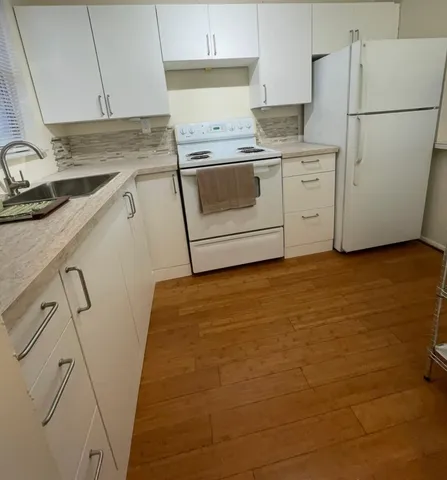 a view of a balcony with wooden floor