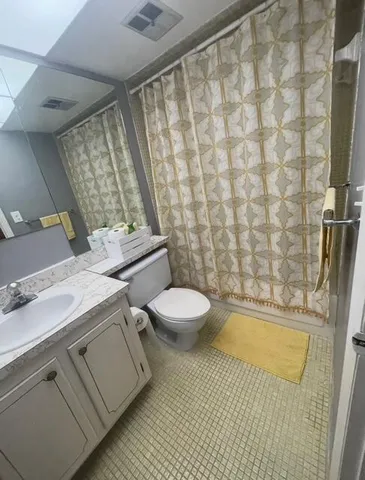 a view of a livingroom with furniture window and wooden floor