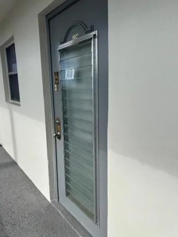 a bathroom with a glass door