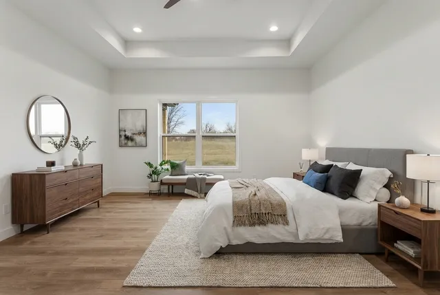 a bedroom with a bed and window