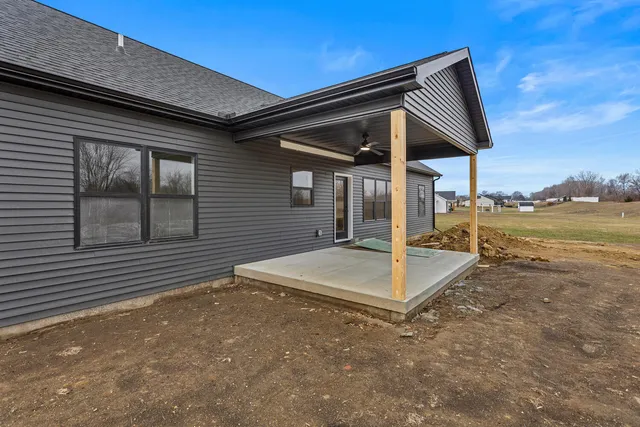 a view of a house with a backyard