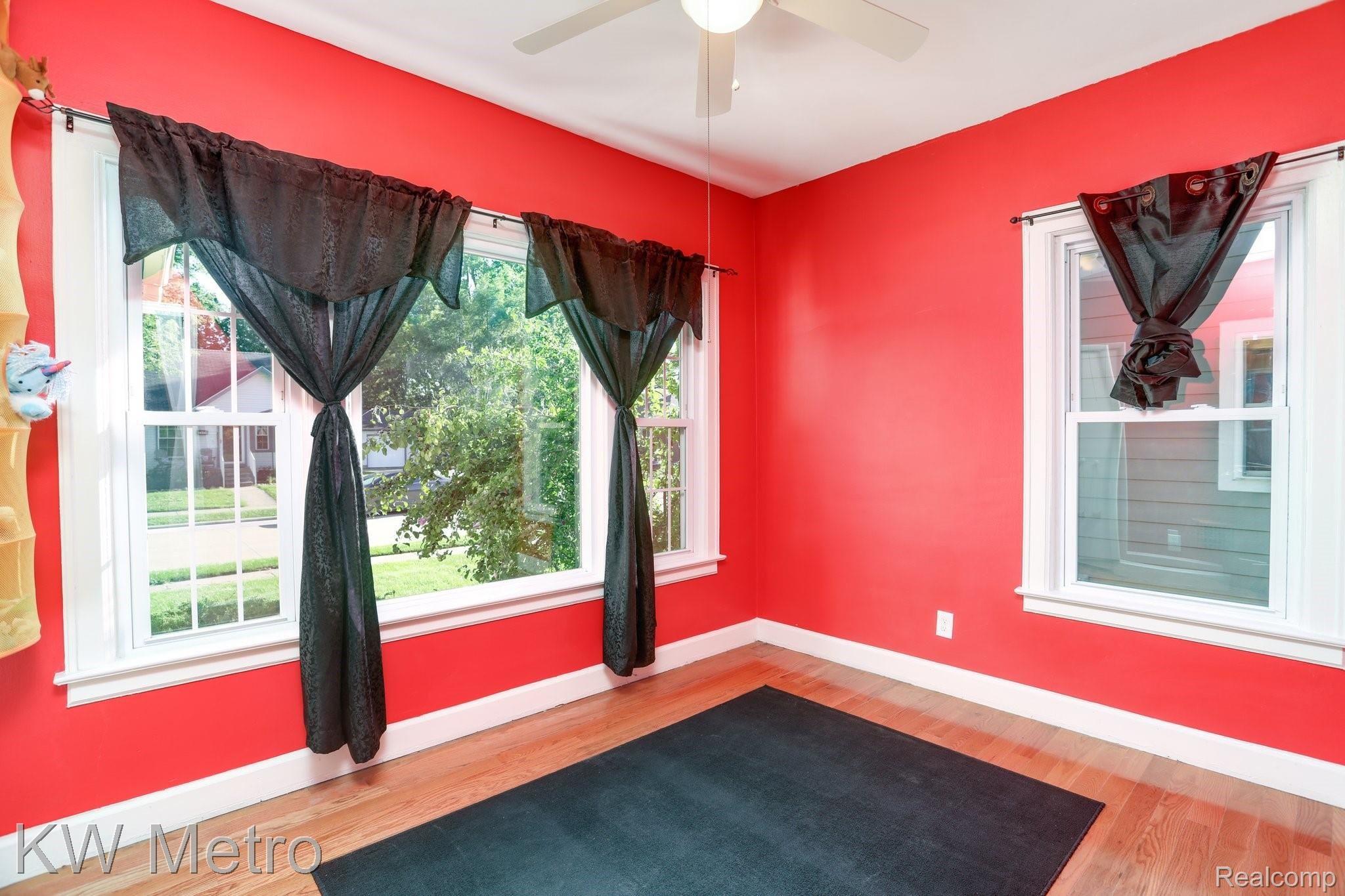 2428 Cambridge Road Berkley, MI 48072 - Photo 15 of 35 Front bedroom with charming, over-sized windows, hardwood floor and ceiling fans in every bedroom.