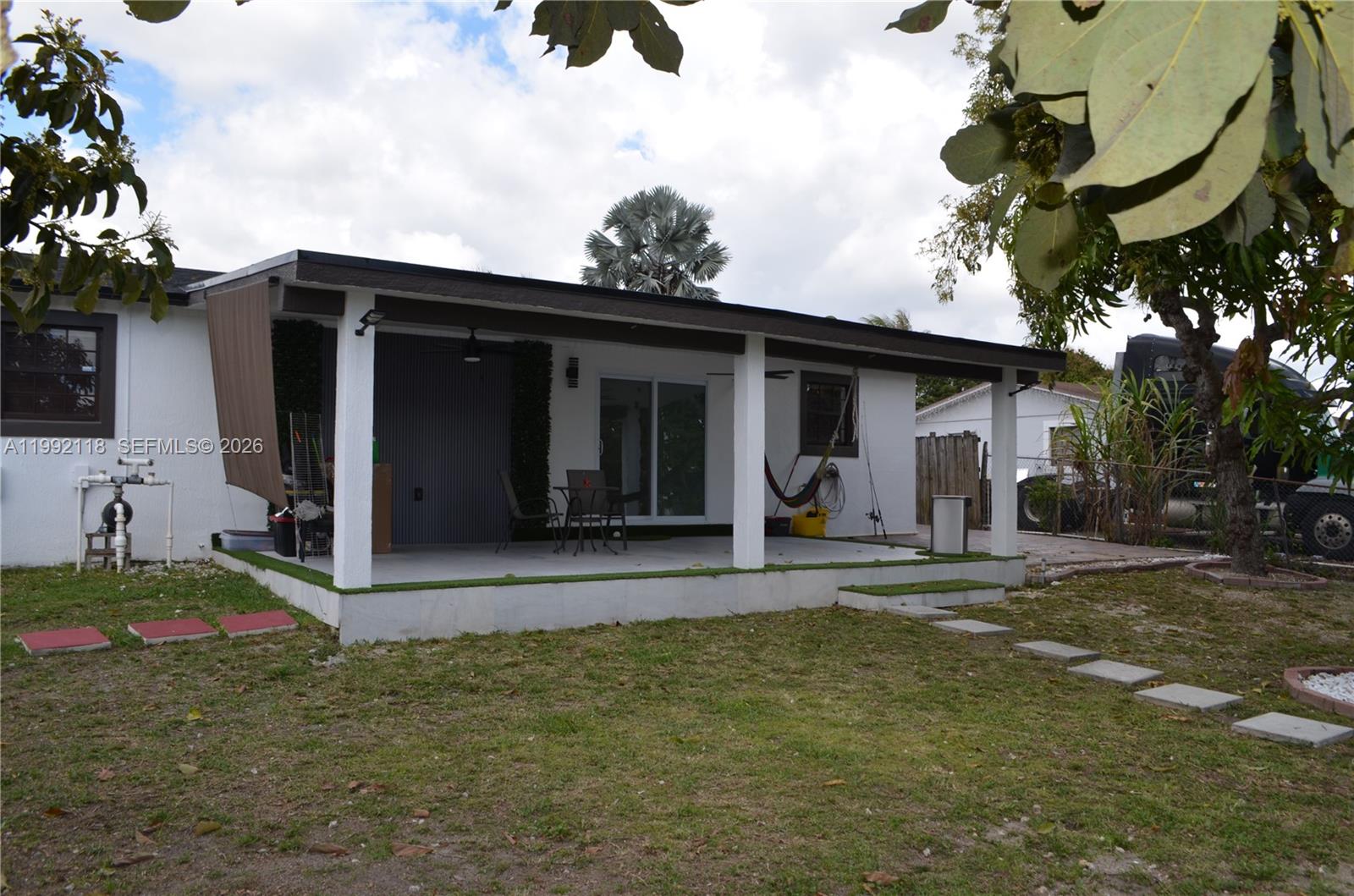 29925 Southwest 143rd Court Homestead, FL 33033 - Photo 27 of 40 a view of a house with backyard