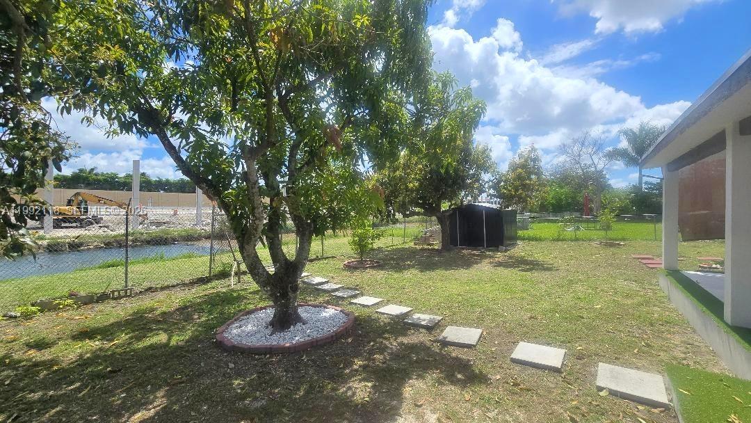 29925 Southwest 143rd Court Homestead, FL 33033 - Photo 29 of 40 a view of a garden with a slide