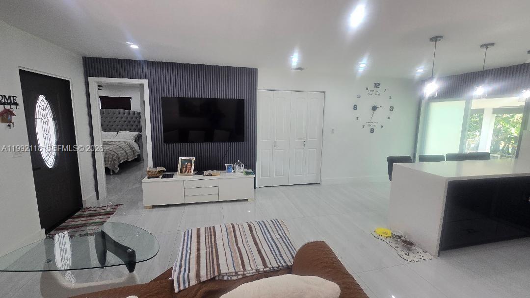 29925 Southwest 143rd Court Homestead, FL 33033 - Photo 3 of 40 a living room with furniture and a flat screen tv