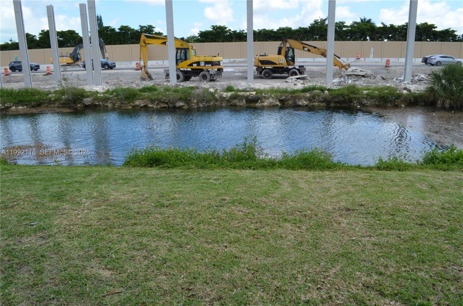 29925 Southwest 143rd Court Homestead, FL 33033 - Photo 31 of 40 a view of a lake with boats and trees in the background