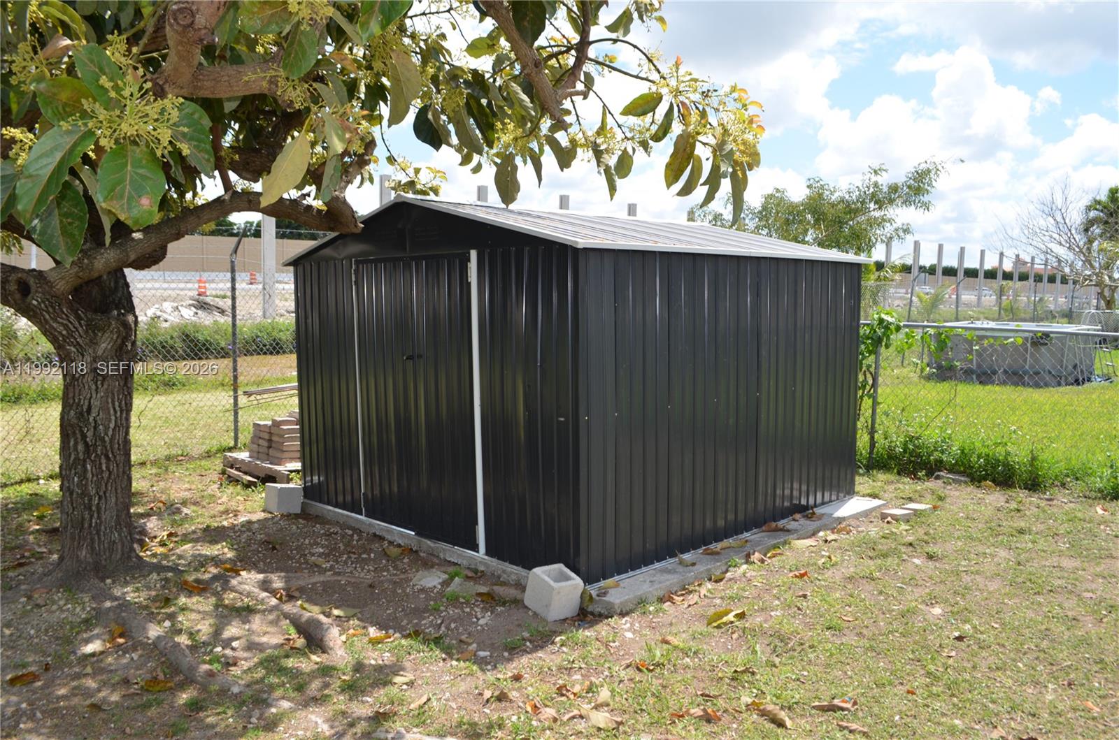 29925 Southwest 143rd Court Homestead, FL 33033 - Photo 33 of 40 a backyard of a house with lots of green space