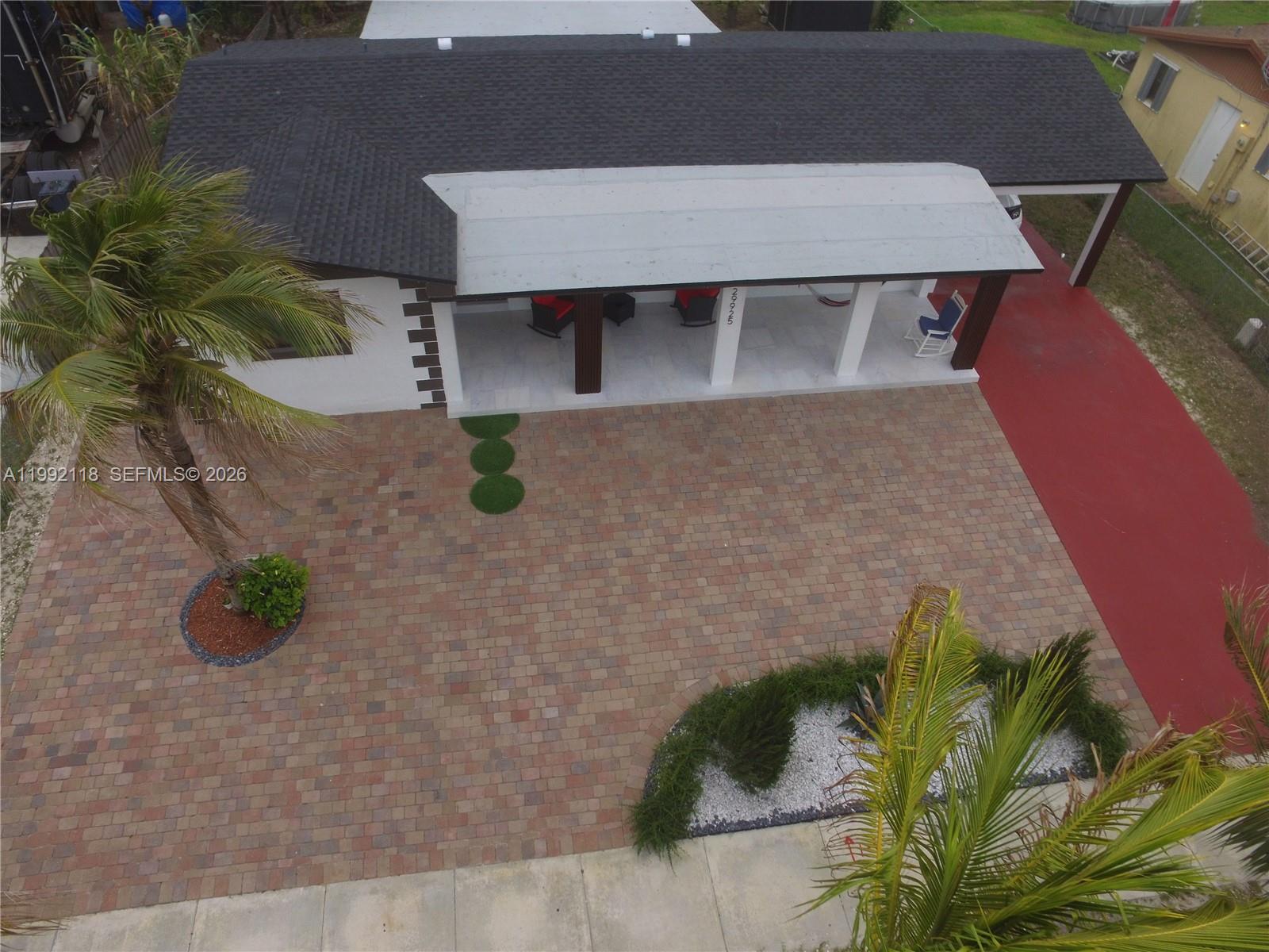 29925 Southwest 143rd Court Homestead, FL 33033 - Photo 36 of 40 an aerial view of a house with a yard and plants