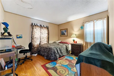 a bedroom with bed and a window