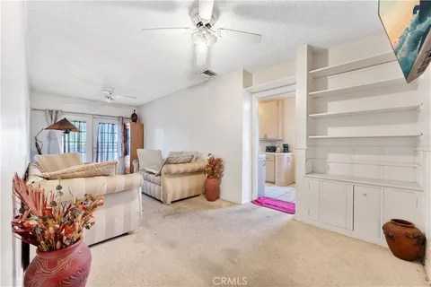 a living room with furniture and white walls