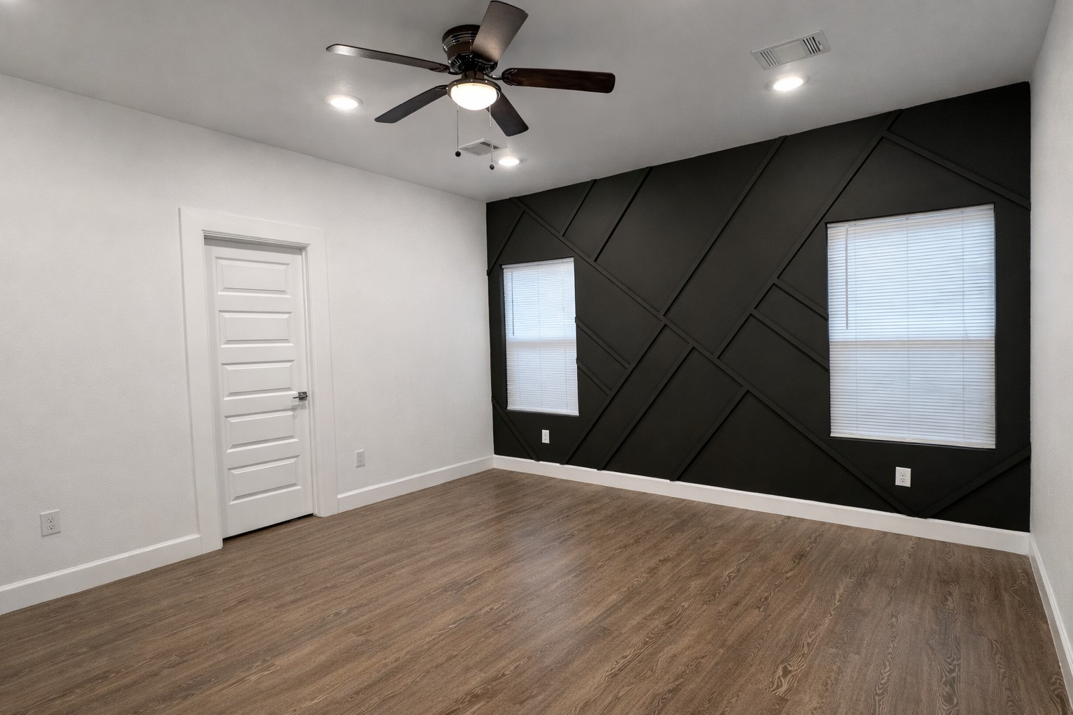 8141 Jeffery Street Houston, TX 77028 - Photo 14 of 27 an empty room with wooden floor closet and windows