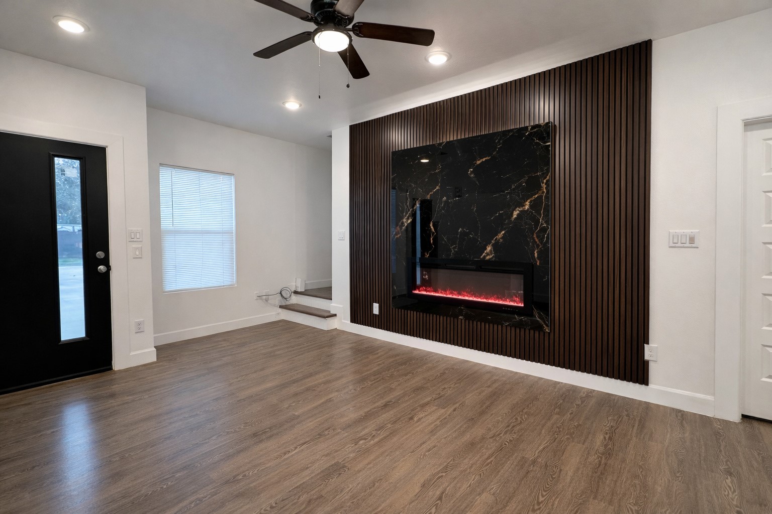 8141 Jeffery Street Houston, TX 77028 - Photo 2 of 27 an empty room with wooden floor and door