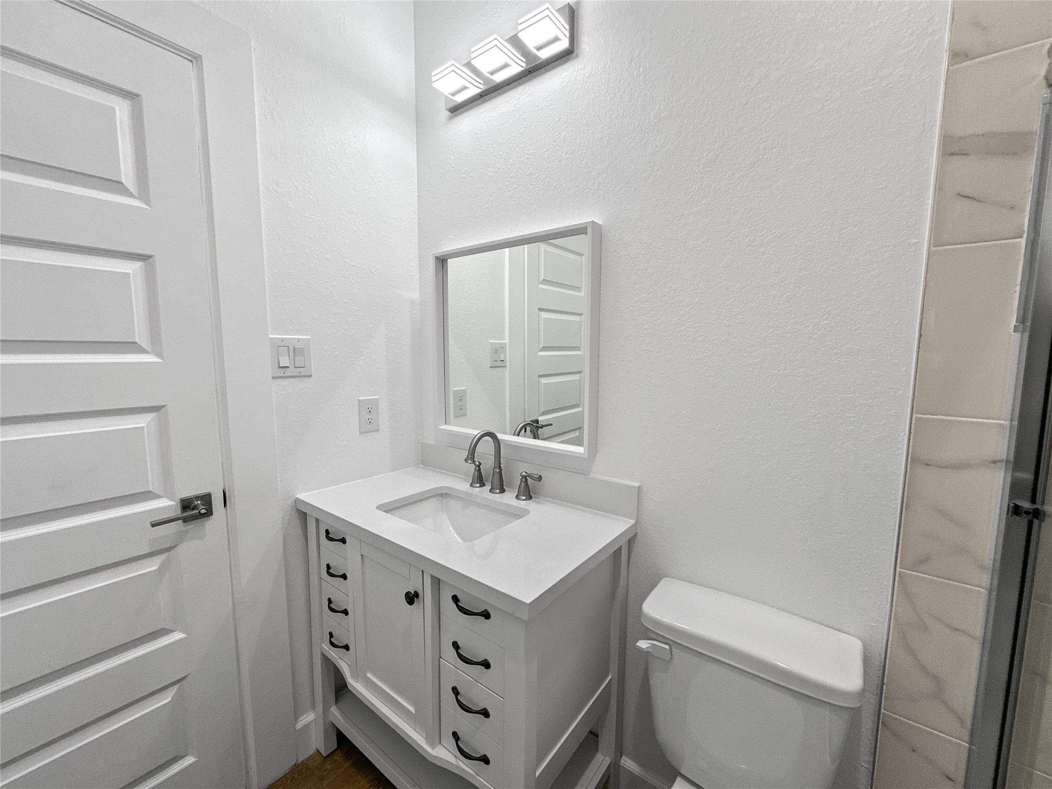 8141 Jeffery Street Houston, TX 77028 - Photo 22 of 27 a bathroom with a sink toilet and mirror