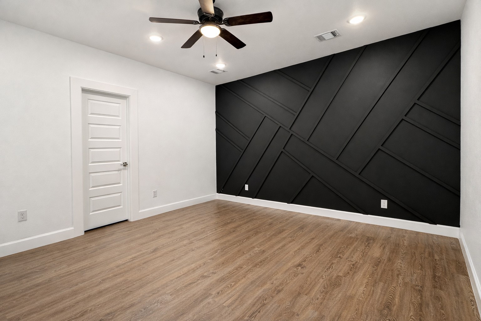 8141 Jeffery Street Houston, TX 77028 - Photo 10 of 27 a view of an empty room with wooden floor