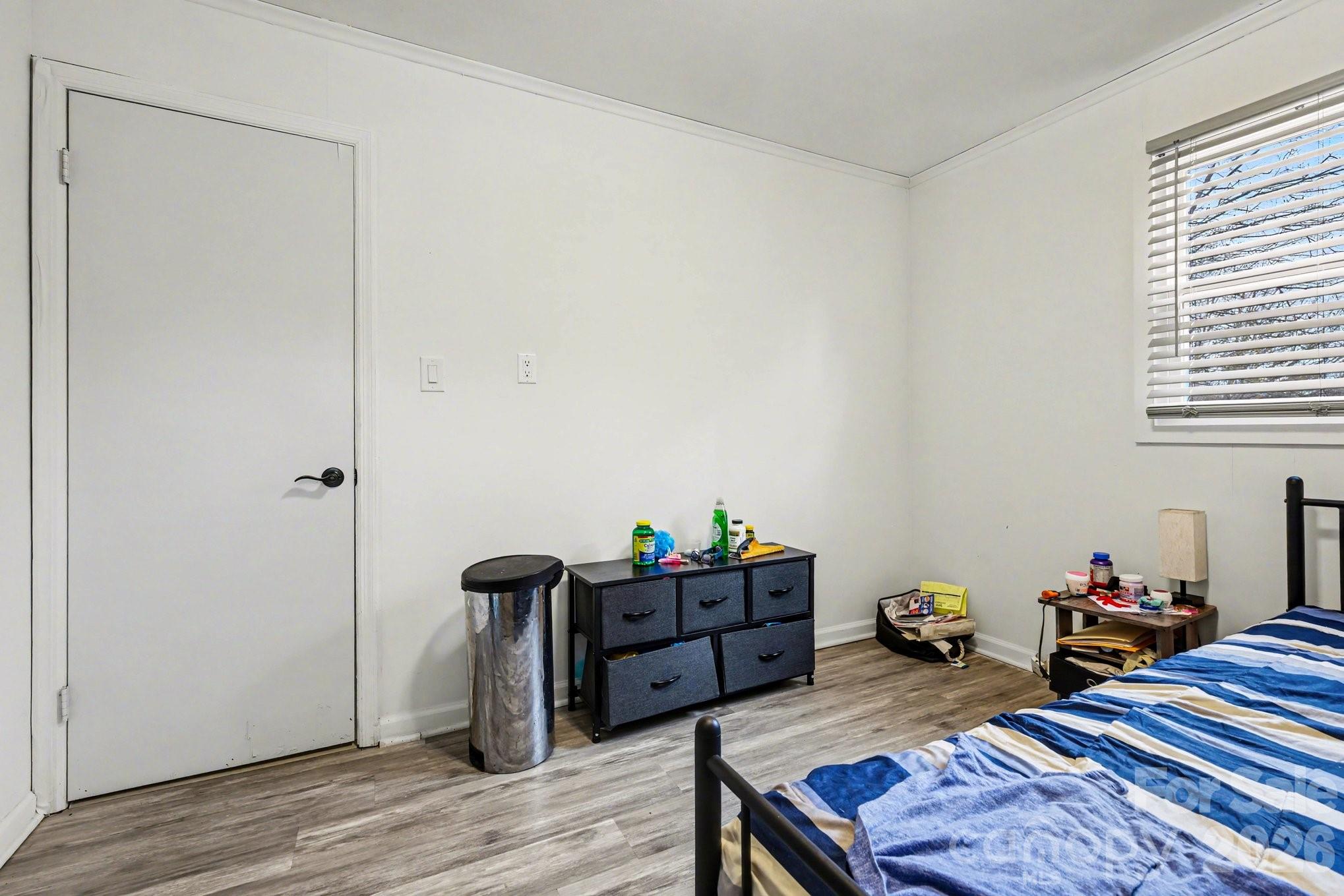 128 Paul Snipes Road Lancaster, SC 29720 - Photo 16 of 29 a bedroom with a bed and wooden floor