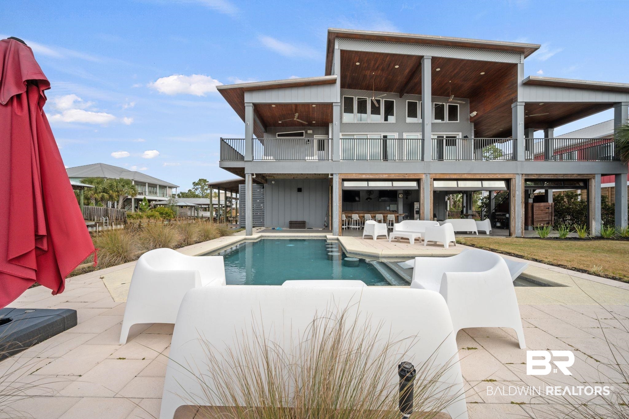 3840 Cotton Way Orange Beach, AL 36561 - Photo 51 of 75 Rear view of house featuring a balcony, ceiling fan, and a patio area