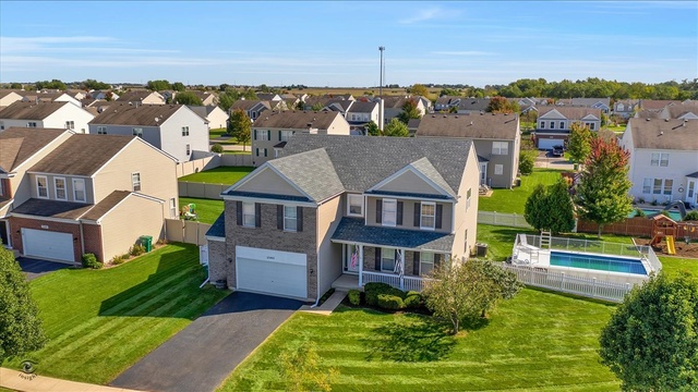 25405 Spring Street Manhattan, IL 60442 - Photo 1 of 36 an aerial view of a house with a big yard