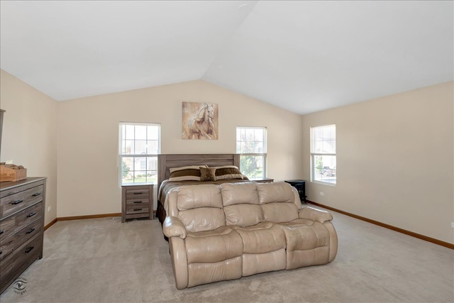 25405 Spring Street Manhattan, IL 60442 - Photo 17 of 36 a bedroom with a bed and window