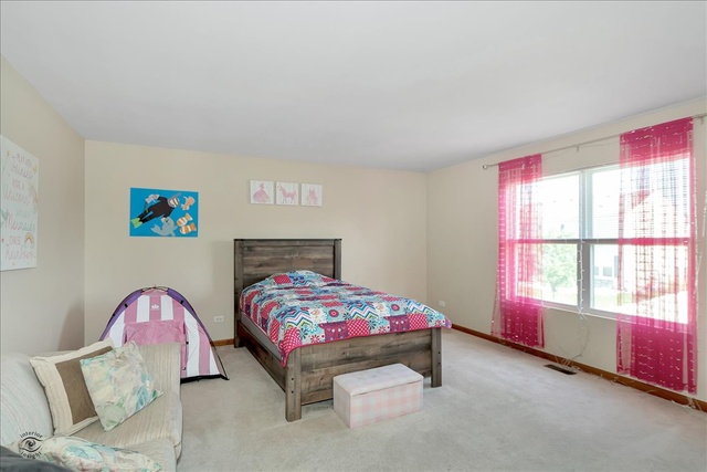 25405 Spring Street Manhattan, IL 60442 - Photo 21 of 36 a bedroom with furniture and a window