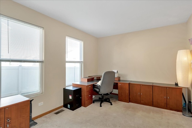 25405 Spring Street Manhattan, IL 60442 - Photo 26 of 36 a view of a workspace with furniture and a window