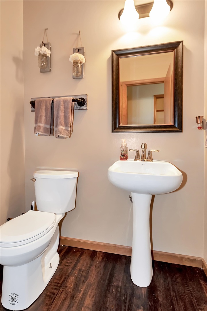 25405 Spring Street Manhattan, IL 60442 - Photo 28 of 36 a bathroom with a toilet sink and mirror