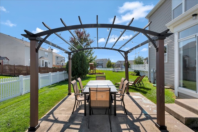 25405 Spring Street Manhattan, IL 60442 - Photo 35 of 36 a patio with table and chairs