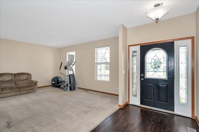 25405 Spring Street Manhattan, IL 60442 - Photo 8 of 36 a view of a livingroom with furniture and hardwood floor